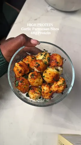 🧄 Garlic Parmesan Bites (High Protein + Low Carb!) Crispy on the outside, soft & cheesy on the inside — and packed with protein 👀 ✨ Recipe: 	•	½ cup shredded mozzarella (fat-free or part-skim) 	•	¼ cup Greek yogurt 	•	2 tbsp egg whites 	•	4 tbsp almond flour (or oat flour for GF) 	•	1 tsp garlic powder 	•	1 tbsp grated Parmesan 	•	Optional: parsley + chili flakes ⏲️ Air fry or bake at 375°F for 8–10 mins 🧈 Brush with garlic butter spray and try not to eat the whole batch 😭 Macros: 520 cals | 48g protein (may vary based on brands used) Tag a snack girlie who needs these ASAP 🔥   #highproteingarlicparmesanbites #highproteindinner #highproteinsnacks #glutenfreerecipes #glutenfreesnacks #defnotbinta #fitnessfood #fitnessfoodie 