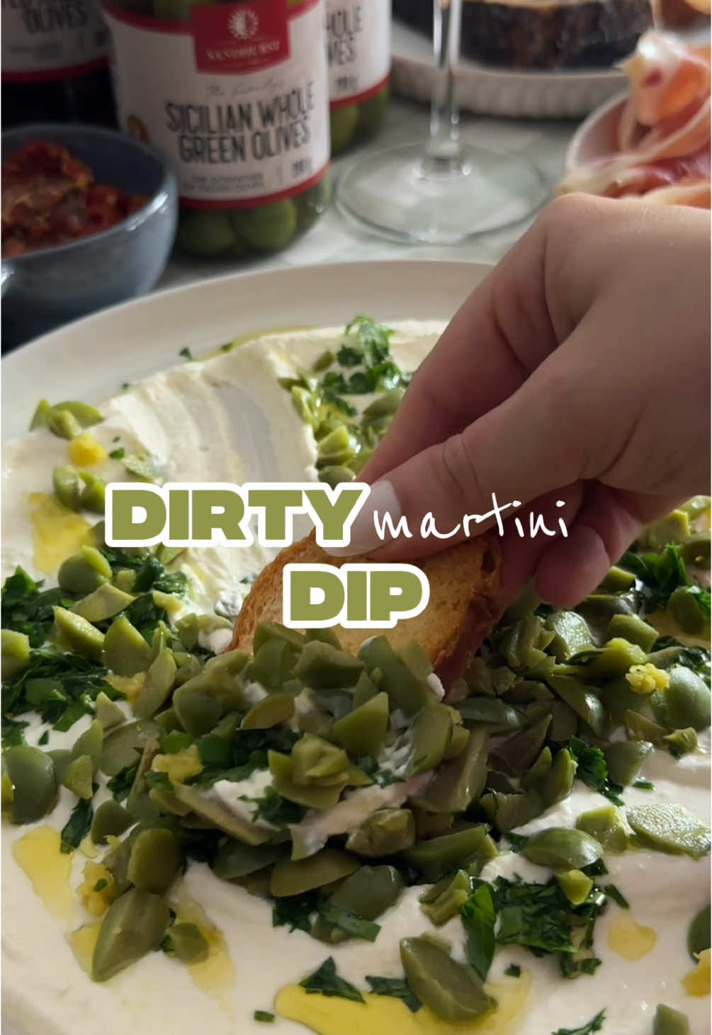 I’ve been living vicariously through everyone else’s Euro summer… so thanks to @sandhurstaustralia I brought the Euro Summer Vibes to my kitchen instead! This dirty martini whipped feta dip UNREAL. Salty, creamy, zesty, a little boozy - and so easy. Full recipe: Blend: 180g feta 85g Greek yoghurt 1 shot gin (or vodka) ½ shot Sandhurst Sicilian Whole Green Olives brine Juice of ½ lemon Top with: Chopped Sandhurst olives Parsley Lemon zest Olive oil drizzle I served mine with cured meats, homemade crostini and of course more Sandhurst antipasti.  AD #whippedfeta #dirtymartini #martini #europeansummer #grazingtable #grazingtables #charcuterie #charcuterieboard #charcuterieboards #olives #antipasti 