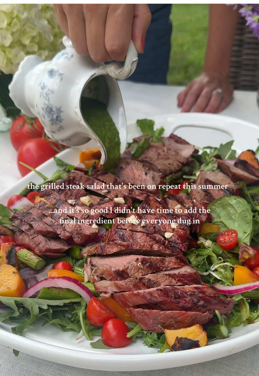 If you have the time to add the Burrata before everyone digs in, it really does add a little something extra 🤣  Our take on the viral grilled steak salad: Arugula and mixed greens  Grilled asparagus  Grilled peaches  Cherry tomatoes  Quick pickled purple onions  Strip steak  Topped with a chimichuri sauce (And pulled Burrata if you remember) #steaksalad #summergrilling #summermenu #summerparty #summerrecipes #grillingseason #summerhosting #seasonalcooking 
