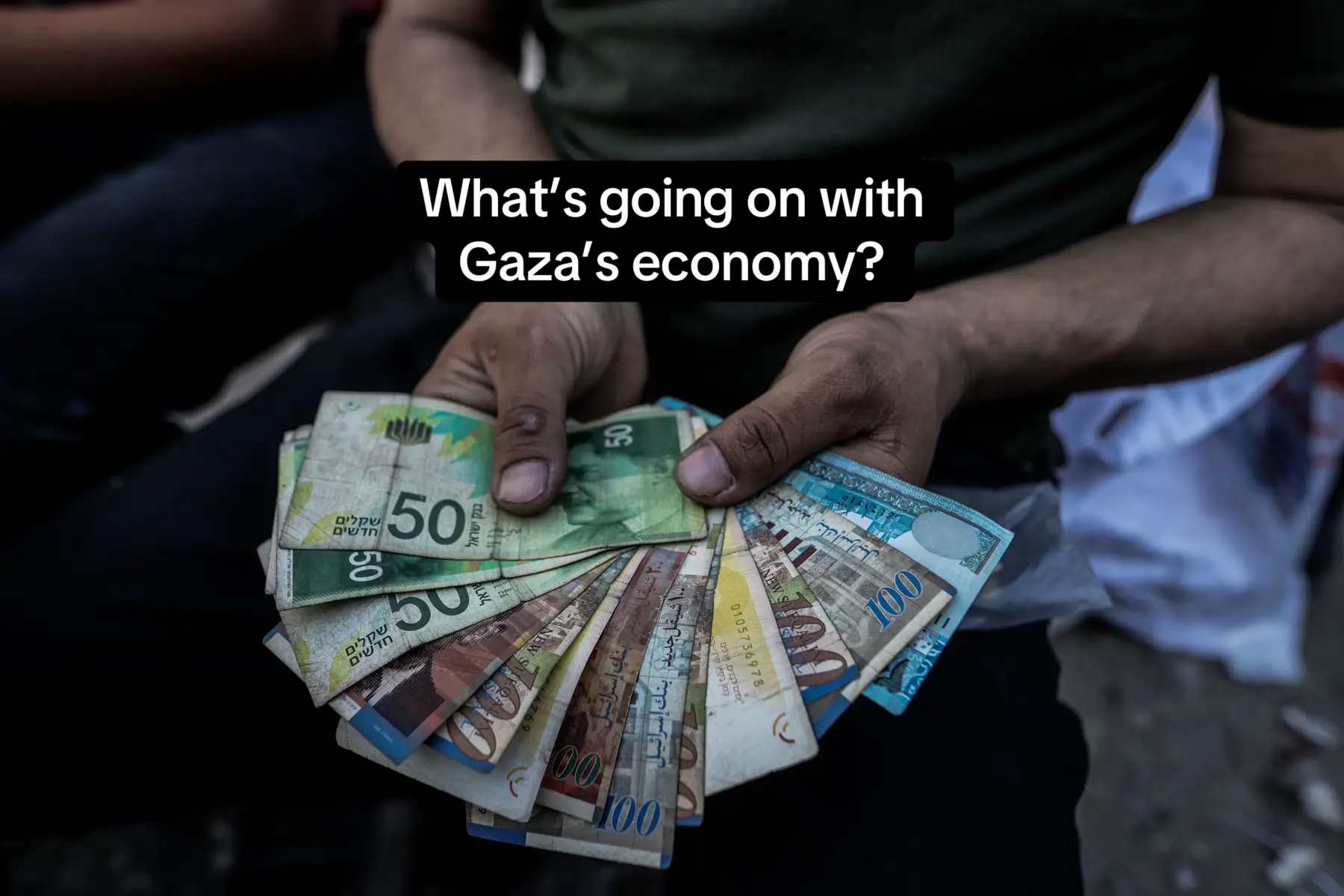 With banks closed or destroyed in Gaza, and ATM machines scarce, people are resorting to desperate measures — including repairing damaged banknotes in order to get by. #economy #banknote #gaza 