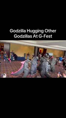 Godzilla hugging other Godzillas at G-Fest.  #godzilla #gfest #gfest2025 #godzillas #godzillaevolved #monsterverse 