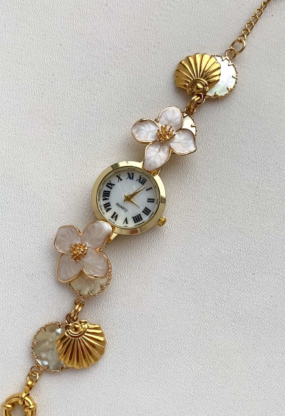 She’s cute, she’s timeless, and she says I know what I’m doing 💞 #classicjewelry #watch  #pearlwatch #goldjewelry #jewelry #vintagevibes #oldmoney #floralwatch #coquettevibes #fairytale #summerjewelry 