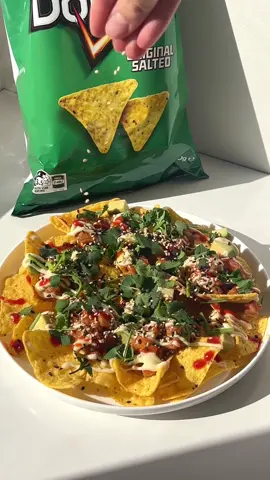 A twist on the classic Spicy Salmon Crispy Rice, try this easy Doritos Loaded Spicy Salmon🍣    Ingredients:  Original Salted Doritos  8 ounces sashimi-grade salmon, cubed  2 tbsp kewpie mayo  1 tbsp soy sauce  1-2 tbsp sriracha sauce  1 tsp sesame oil  Scallion, finely sliced  Avocado, thinly sliced  Cilantro  Sesame seeds    In a bowl, combine the salmon with kewpie, soy sauce, sriracha, sesame oil and scallion. Mix well to combine.    Spread your Doritos chips evenly onto a plate and top with avocado, followed by a spoonful of the spicy salmon mix, extra drizzles of mayo & sriracha, cilantro and sesame seeds.     @flvr global , #FLVR #doritos   #doritosrecipe #doritosloaded #ad #partnership #spicysalmon #crispyrice 