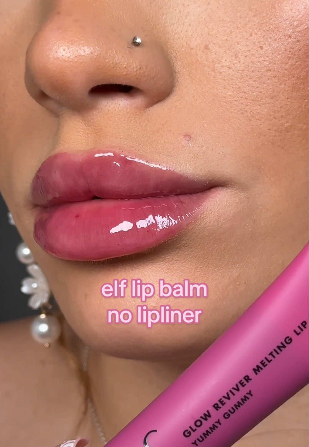 Replying to @Mils💋 swatching the viral elf pinky purple lipgloss without lipliner 💕 @e.l.f. Cosmetics UK new glow reviver melting lip balm 'yummy gummy' 🍇🍬 @e.l.f. Cosmetics  #elfcosmetics #eyeslipsface #elflipbalm #lipbalm #lipswatch #glossylips #affordablemakeup