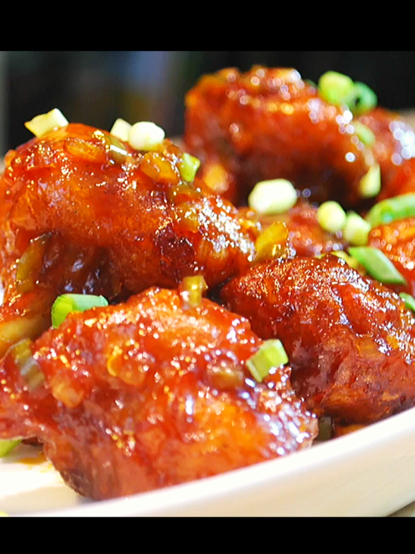 Spicy and sweet chicken lollipop recipe  Ingredients 5 Chicken Wings (Makes 10 lollipops) 1 Cup All purpose flour 1/2 Cup Corn starch 1 Tbsp Red chilli powder 1 Tsp Salt 1/2 Tsp Black Pepper powder 3 Cloves garlic 1/2 Onion  1 Green Chilli  1/3 Cup Sweet Chilli sauce Green onion for garnish . . . #foryoupage #fyp #trending #chickenlollipop #crispychicken #EasyRecipes #tiktokfood