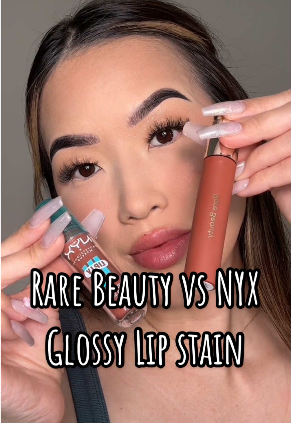 They may look similar in the packaging 🔍✨ but the NYX lip oil leans more cool-toned, while Rare Beauty’s has a richer pigment payoff 💋 Comparing high-end vs affordable🤗🥰 #lipoil #lipstain #liptutorial 