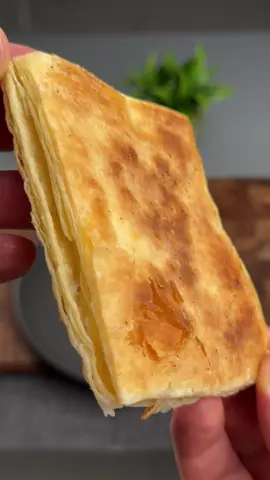 #VNVideoEditor                                         Make delicious puff pastry in minutes, without an oven.                            Make delicious puff pastry in minutes, without an oven. INGREDIENTS: ●Puff pastry - 300 g Cheese - 3 pieces (60 g) ●Butter - 30 g 1. Defrost the finished dough at room temperature for 40 minutes. 2. Divide the defrosted dough into 3 equal rectangles. 3. Grease the frying pan with melted butter and fry the pieces of dough on both sides over low heat (4/9) for about 8-9 minutes. 4. 3 minutes before the second side of the puff pastry is ready, the dough can be easily opened and pieces of cheese added to the middle. 5. As soon as the cheese begins to melt, you can try!  ●It's incredibly delicious and very simple!!!● Bon appetit! The recipe in your language is available in the description, 💖🇺🇦🇵🇱🇩🇪🇺🇸🇫🇰🇪🇸🇵🇹🇮🇹🇷🇴 🇷🇸🇭🇷🇱🇻🇸🇮🇨🇿🇫🇮🇸🇪🇩🇰🇳🇴 🇯🇵 🇬🇷 🇮🇱🇰🇿🇰🇬🇱🇻🇹🇼 🇵🇪 🇦🇷 🇨🇱 🇻🇪 🇹🇭 🇧🇷                     #puffpastry #puffpastryrecipe #appetizer #simplydeliciousrecipes 