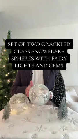 STUNNING, is the best way to describe the set of two, crackled glass spheres, with snowflakes, gems, and gorgeous fairy lights inside! Designed designed by Valerie Parr Hill, sold by QVC! They come in white, pink, and blue and there is a six hour timer function.  These are not just for the holidays, they are all winter long! #christmasinjuly #qvc #valerieparrhill #elegantchristmasdecorations #christmasdecorations #christmasdecorideas 