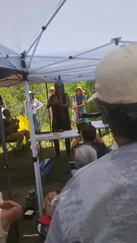 Native prayer using a flute in response for the people inside Alligator Alcatraz