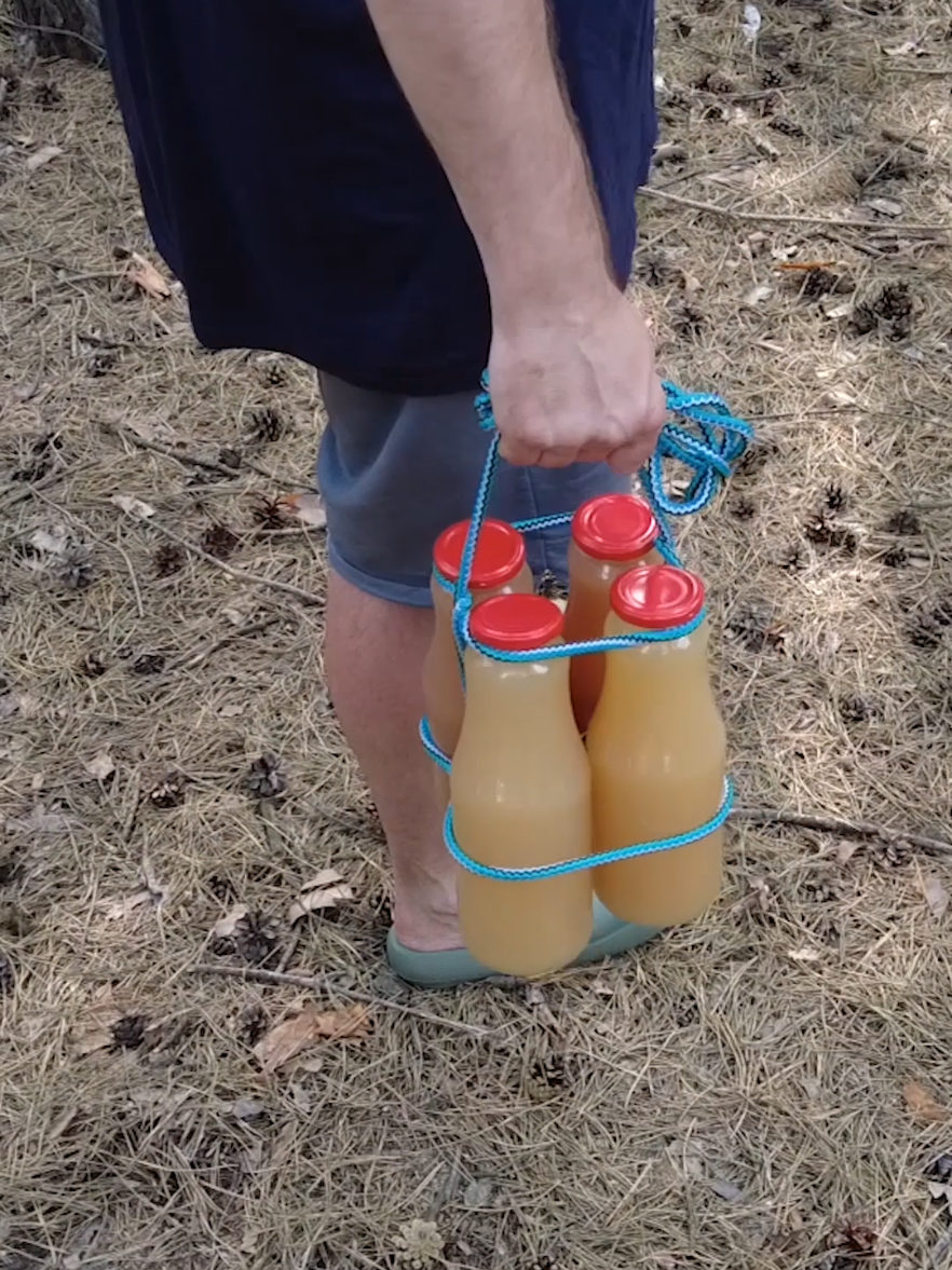 Carrying multiple bottles while hiking or camping can be a hassle - but this simple rope trick makes it easy! Learn how to quickly tie several bottles together using just a piece of rope, making them much easier to carry over long distances. Perfect  for hikers, campers, survivalists, or anyone who needs a fast and practical carrying solution in the wild. #CampingHack #OutdoorSkills #HikingTrick #PrepperTips #OffGrid #Bushcraft