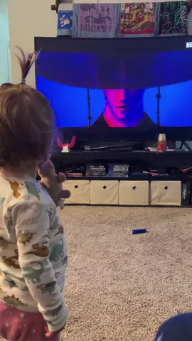 Introducing my 1 year old daughter to the right influences. Also the way she dances and the way she drops her pack when soda pop comes on 🤣  p.s. it was lazy pj cleaning day so she looks feral and the house is icky- please ignor 😭#kpopdemonhunters #kpop #demon #sodapop #sajaboys #huntrix #demonhunter #toddlersoftiktok #toddler #dance #idol 
