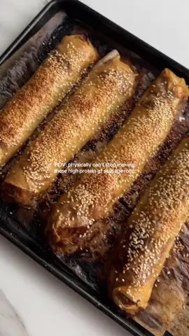 Rice Paper Sausage Rolls (300 cals & 27g protein each) Recipe (makes 5 large sausage rolls): - 10x rice paper sheets (2x per roll) - 2 eggs + 1/4 cup water - oil spray + sesame seeds for topping Filling: - 500g lean beef mince - 1/2 cup baby spinach chopped finely  - 1 large carrot grated - 1 large zucchini grated (juices squeezed out) - 1/4 large onion, diced - 1-2 tsp minced garlic - 4 heaped tbsp tomato paste - 1 heaped tbsp soy sauce/tamari or wostersechire sauce - seasonings of choice- I use @mingleseasoning chilli umami seasoning - salt & pepper to taste 1. pre-heat oven to 200c 2. mix the filling ingredients well and set aside 3. crack 2 eggs & 1/4 cup water with salt & pepper into a shallow bowl 4. Dip 2 rice paper sheets into the mix and lay them down overlapping each other (refer to video) 5. Fill with the beef mince filling and roll into a sausage roll making sure the sides are tucked in. Repeat this until you make 5 sausage rolls. 6. Add onto a baking tray lined with parchment paper and spray lightly with some oil spray and top with sesame seeds(optional) 7. Bake for 20 mins, then flip halfway and bake for another 10-15 minutes *Store in the fridge for up to 5 days and re-heat in the microwave or airfryer for a crunchier sausage roll. Macros per roll (5): Calories: 300 Protein: 27g Carbohydrates: 24g Fat: 11g #gfsausagerolls #ricepaper #ricepaperrecipes #healthysausagerolls #lowcaloriesausageroll #ricepapersausagerolls 