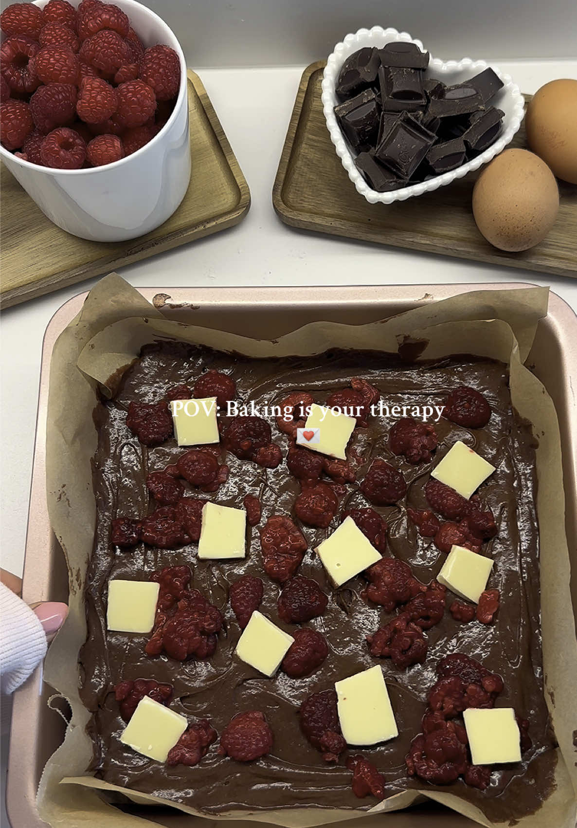 Baking therapy <3 #baking #bakingrecipe #brownie #bakingtherapy #therapy #fyp  👩🏼‍🍳Fudgy Brownies recipe: 200g dark chocolate 140g butter 150g sugar 150g brown sugar 4 eggs 1/2 tsp salt 1 1/2 tsp vanilla essence/extract 125g all-purpose flour 25g cocoa powder 100g raspberries 100g dark chocolate (if u want extra inside the brownie 50-100g white chocolate method: 1.    Preheat oven to 180 degrees Celcius. 2.    Over a double boiler on the stove, melt chocolate and butter together until glossy and smooth. Set aside to cool to room temperature. 3.    Combine sugar, brown sugar, and eggs, then beat until pale and doubled in size-this is a very important step and is how your brownies will achieve a shiny cracked surface. 4.    Add salt and vanilla and gently stir. 5.    Fold in chocolate. 6.    Sift in flour and cocoa powder and gently fold in. 7. You can fold extra chocolate in at this step.  8. Add raspberries and white chocolate on top  Bake for 35-45 minutes on 160 degrees Celsius  Let cool before cutting or over night in the fridge 💌