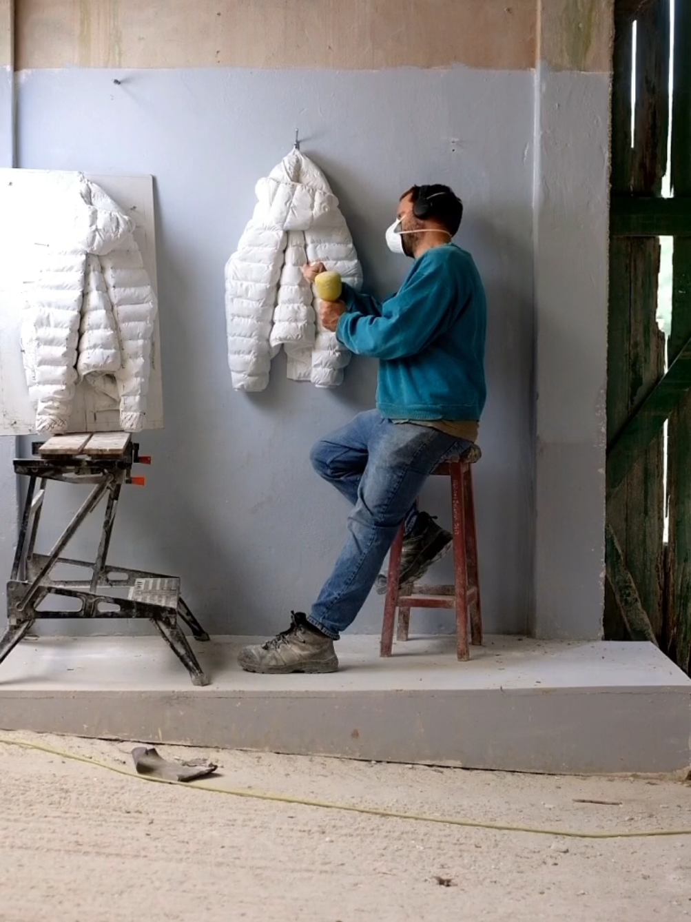 Carving a puffer jacket in marble. #fyp #fypage #marble #marblesculpture 