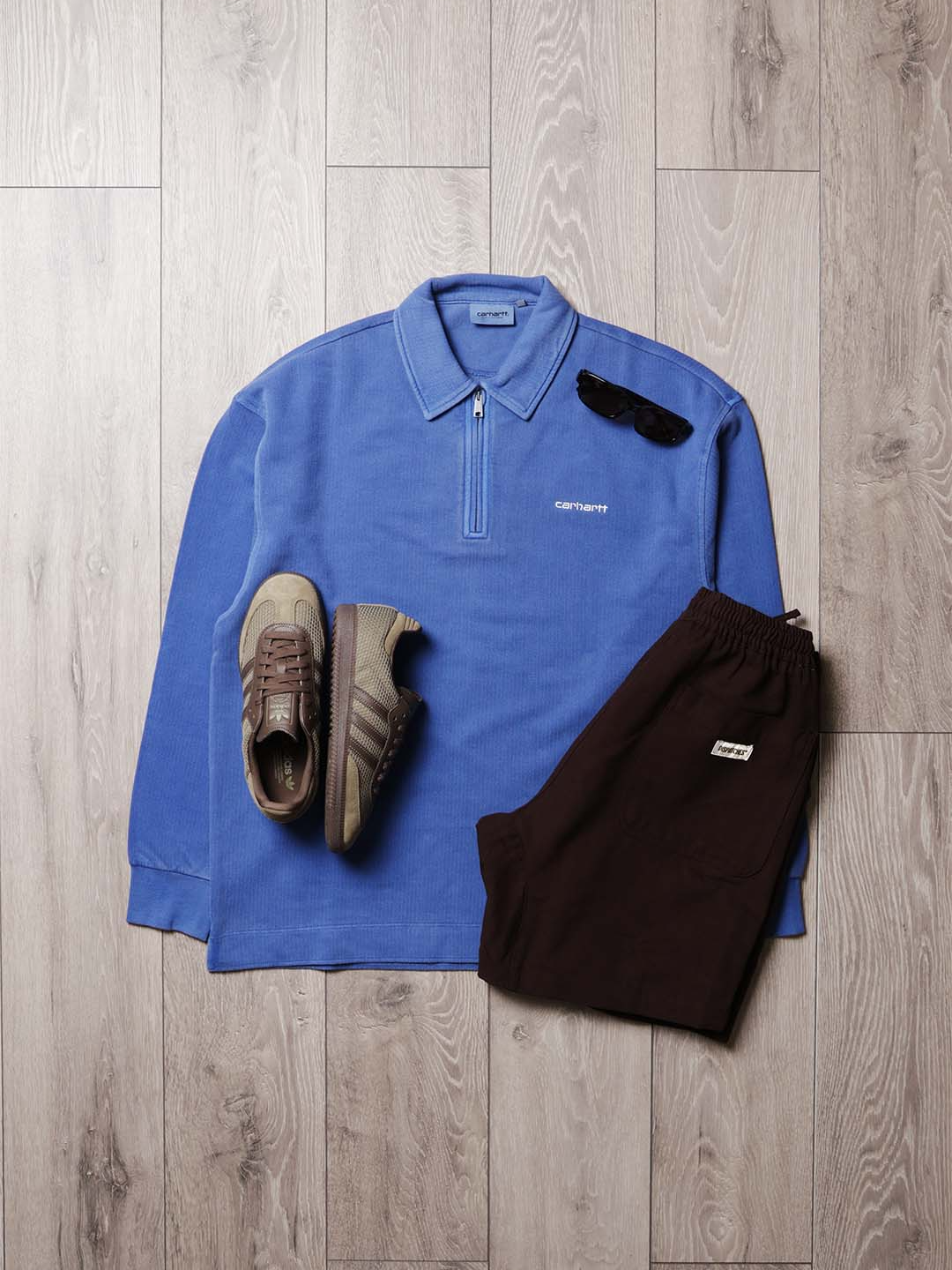 This week we put together a fit for Summer evenings. The Carhartt WIP Pique Sweatshirt is a perfect heavy cotton, but still breathable layer perfect for wearing after a day in the sun. Paired here with the Dispatches Depot Shorts in Tobacco brown and a pair of Adidas Originals Samba OG Shoes. All available now, online or in store. @carharttwip @adidasoriginalss  #urbanindustry #dispatches #akjaerbede #carharttwip #outfit