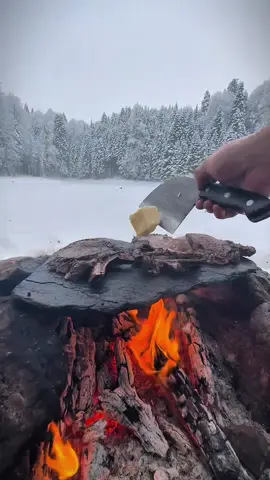 Grilling beef on a swedish torch in the snow in the middle of nature 🥩🌨🪵🔥 #cookingasmr #outdoorcooking #leon #Recipe #cookingnature #camping #foodtiktok #girlling #beef 