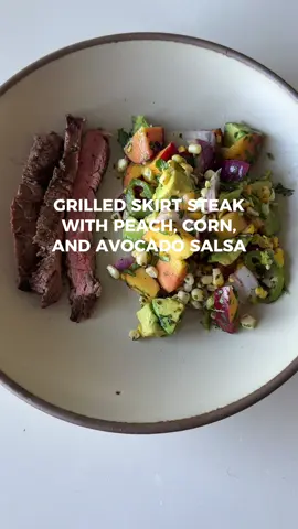 The most summery recipe to ever exist ☀️🌽 grilled skirt steak marinated in a cumin cilantro lime marinade then grilled alongside peaches, corn, red onion, and jalapeño. The grilled fruit and veggies are tossed with creamy avocado, lime juice, and cilantro. SO SO GOOD!  #skirtsteak #grilling #peaches #corn #summerrecipe #carolbeecooks 