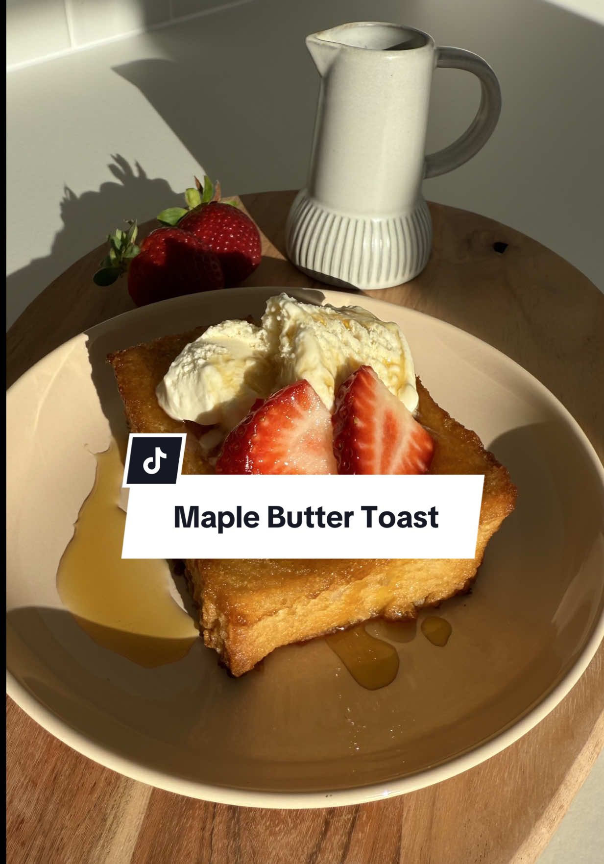 Maple syrup, strawberries, ice cream…and golden crispy toast. Dessert just became your new favourite snack hack 🍓✨ Ingredients (3-4 slices): 1 white block loaf, unsliced 3 tbls butter, softened  2 tbls maple syrup (plus extra for drizzling) Pinch sea salt 2 tbls brown sugar Vanilla ice cream, to serve Fresh strawberries, sliced Method: Preheat oven to 180°C (350°F). Cut loaf into 2cm slices, remove crusts, to form thick squares. In a bowl, mix butter, maple syrup, salt, and brown sugar into a thick paste. Coat all sides of the bread squares with the maple butter paste. Place on a lined baking tray and bake for 20 minutes, flipping halfway, until golden and crisp. Let cool for 5-10 minutes to crisp up further. Serve warm, topped with vanilla ice cream, sliced strawberries, and an extra drizzle of maple syrup. Enjoy ♡  #maplesyrup #easydessert #S#StrawberryDessertsnackhack #C#CrispyToastS#SimpleRecipesD#DessertInspoH#HomeBakingF#Foodiequickrecipe 