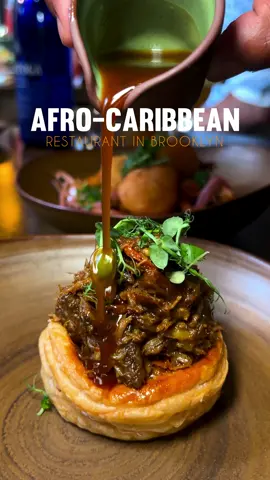 🗣️There’s a NEW Afro-Caribbean Restaurant in Brooklyn  Idk if I can forgive yall for gatekeeping Mango Bay in Brooklyn! It was a SO good went two times in the past month and I’m ready to make my 3rd reservation to check out the brunch menu. If you know, this was formerly Imani’s and is now they’re a new Afro Caribbean restaurant inside a Brownstown, led by chef London who deserves his flowers because, the menu goes crazy 🔥. 📍 Mango Bay / 271 Adelphi Street, Brooklyn, New York City  ✨ The Goat Puff Pastry  ✨ Braised Oxtail ✨ Peppa Shrimp ✨ Ras and Pasta ✨ Mango Puff Pastry  is a must! It comes with a nice presentation where they shower the puff with curry sauce. The puff was flakey too. We quickly put that away before my drink arrived. The cocktail menu is top notch and regardless if you’re an alcohol drinker or not, the menu is well thought out and delicious.  Yes, this is an Oxtail Stan account and I approve of their juicy tender oxtail!!! I can’t recommend them enough!  Check them out ❤️ #nycdinner#nyc#nyctok #foodontiktok#afrocaribbean#foodreview#carribean#nyceats#nycrestaurants#brooklyn#oxtail#jamaican #newrestaurant 
