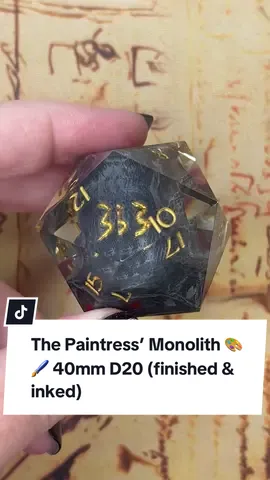 The Paintress’ Monolith 🎨 🖌️ (40mm D20) Finished- fully polished & inked. Thank you all for the love you have shown for this die! We honestly didn’t expect this to take off as much as it did. We’ve had a lot of questions about when this would be available and we’re still working over some details. Please keep in mind we are a two person, handmade dice making duo so projects like this take time. Thanks for sticking with us! 💚 #clairobscur #clairobscurexpedition33 #dice #d20 #dnd 