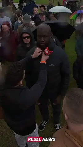 Self-proclaimed Nazis tried hijacking a Christian rally — using a disturbed black “white supremacist” as a prop. But organisers and the crowd saw through the stunt — and BOOTED them out FAST. EPIC backfire. 📽️ Full video: RebelNews.com.au