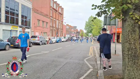 Bessbrook True Blues Flute Band on parade through the Streets of South Belfast for South Belfast Young Conquerors Flute Band's Annual parade 