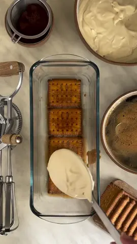 Tiramisu Icebox Cake  Ingredients: Coffee Syrup: 180g brewed espresso or strong brewed coffee 15g sugar 30g coffee liqueur like Kahlúa or brandy or rum Zabaglione: 75g egg yolks (from approximately 3 large eggs) 70g sugar 30g Marsala wine or coffee liqueur Mascarpone Cream: 250g mascarpone cheese, room temperature 150g heavy whipping cream Chocolate Ganache: 150g heavy whipping cream 120g dark chocolate 70%, chopped 2 tablespoons coffee syrup Assembly: About 40g fine cocoa powder, sifted About 250g high-quality petit beurre biscuits #tiramisu #tiramisucake #cake 