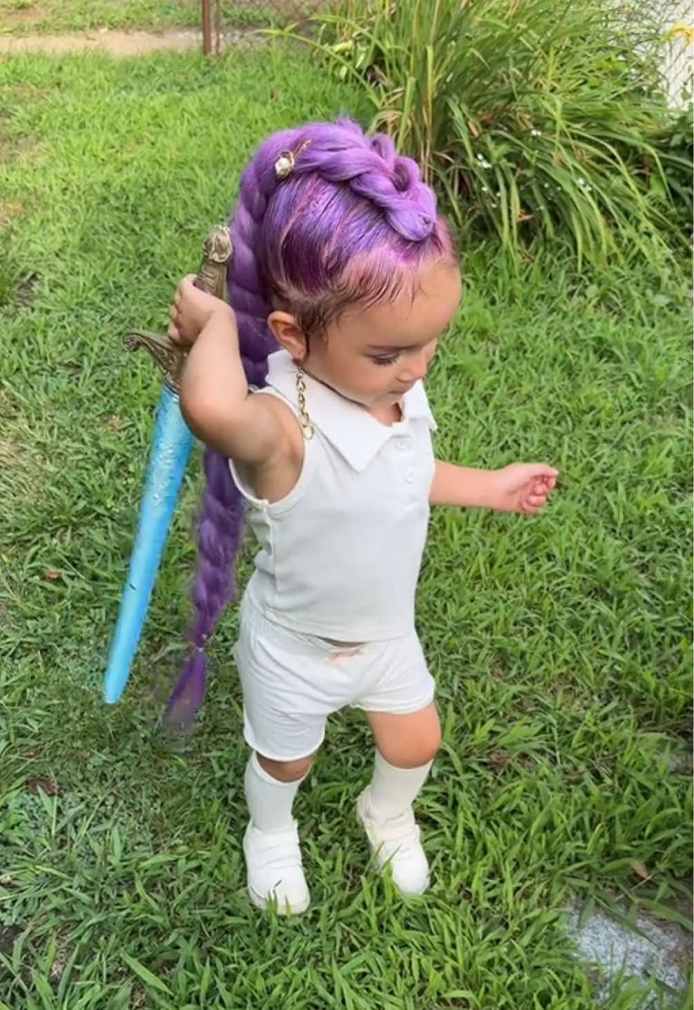 Replying to @️                         Meet Rumi — K-pop’s fiercest demon hunter 🔮⚔️💜 Braided for battle and ready to slay in style.” #KpopInspired #DemonHunterAesthetic #ToddlerHairstyleGoals #FantasyVibes #PurpleBraidPower “K-pop Demon Hunter Hairstyle Transformation 👧🏽💜⚔️”.                This isn’t just a braid — it’s a battle braid. Inspired by fantasy warriors and K-pop idols, this purple masterpiece is locked, loaded, and jeweled for the spotlight. Watch out demons, Rumi’s coming for you — and she’s doing it in style! 💫🧝🏽‍♀️✨