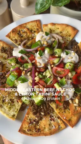 MIDDLE EASTERN BEEF NACHOS WITH LEMON TAHINI SAUCE 🍋🤤 Crispy spiced pita chips. Juicy, spiced beef. Herby salad. And the creamiest lemon, garlic tahini sauce to bring it all together. This tastes like something from a restaurant but takes just 20 minutes. High-protein, healthy, and insanely good. You need this in your weekly dinner rotation 🔥   Serves 2 Macros (per serve): • 496kcal • 40.4g P • 49.8g C • 16.9g F Ingredients Pita Nachos • 2 low-calorie pita breads, 2 heaped tsp za'atar spice, 1 tsp chili flakes + 1 tsp salt Spiced Mince • 250g lean beef mince, 1 heaped tbsp za’atar, ¼ tsp chili flakes + ½ tsp salt • 2 cloves garlic, minced Herby Salad • ½ cucumber, diced • 10 cherry tomatoes, quartered • ½ red onion, thinly sliced • 3 tbsp chopped fresh mint • 3 tbsp chopped parsley • 1 tbsp olive oil • Squeeze of lemon juice • ½ tsp salt   Lemon Garlic Tahini Sauce • 3 heaped tbsp Greek yoghurt • 1 tbsp tahini • 1 tbsp lemon juice (I use a little more as I like mine lemony) • 1 large clove garlic finely minced • ½ tsp salt ✨ Optional Garnish: • Toasted pine nuts or extra herbs   Method 1. Make the Sauce: Whisk together yoghurt, tahini, lemon juice, garlic, and salt until smooth.  2. Chop the Salad: Mix cucumber, tomato, red onion, mint, parsley, olive oil, lemon juice, and salt. Toss, taste, season and set aside. 3. Crisp the Pita Chips: Cut each pita bread into 8 triangles. Lightly spray with olive oil, sprinkle with za’atar, chili flakes, and salt. Air fry at 190°C for 5–6 mins or until golden and crisp. 4. Cook the Mince: In a hot pan, add a drizzle of oil and cook garlic for 30 seconds. Add beef, za’atar, chili flakes, salt, and ¼ cup water. Cook until browned and saucy (about 5 minutes). Taste and season.  5. Assemble: Layer crispy pita chips on a plate. Spoon over the beef, then the herby salad, then drizzle with the tahini sauce. Garnish with pine nuts if using—and devour!  