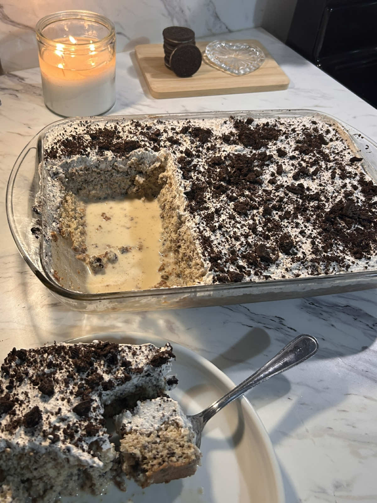 oreo tres leches 🤍    homemade oreo cake :   1 cup cake flour (120g) 1/4 tsp salt (1.5g) 1 1/2 tsp baking powder (6g) 5 eggs, separated  1 cup granulated sugar (200g) 1/4 cup milk (60g) 1/4 cup neutral oil (55g) 1 tbsp vanilla bean paste (18g) or 2 tsp vanilla extract (10g) 8 oreo cookies crushed   whisk together flour, baking powder, salt, and the crushed Oreos & set aside.    in a large bowl. Beat the egg yolks with a half cup of sugar until pale and thick. then add in the milk, oil and vanilla.    In a clean dry bowl beat the egg whites until soft peaks form then gradually add the other half cup of sugar and beat until stiff peaks form. (should be glossy and holds shape)    fold the dry ingredients into the yolk mixture until combined, then GENTLY fold in the egg whites in three parts until just combined. don’t overmix!    grease a 9 x 13 baking pan and pour the mixture into the pan bake at 350•F for 25-30 minutes. ( or until a toothpick comes out clean )   three milk soak: 1 can evaporated milk 1 can sweetened condensed milk 1 cup whole milk (240g) 1 tsp vanilla extract (5g) whisk together the milks and vanilla and set aside in the refrigerator until you’re ready to use.    once the cake is done, let cool completely. then poke holes into the cake with a fork and pour the milk mixture over until the cake is evenly saturated. let cool for about 4 hours.    oreo whipped topping:   1 1/2 cups heavy whipping cream (360g) 1/3 cup powdered sugar (40g)(adjust to taste) about 1/2 cup crushed Oreos (55g)   beat the cream, powdered sugar, & vanilla until stiff peaks form, then fold in oreos and spread evenly over your chilled cake.    top with crushed oreos and enjoy ! :)   #oreo #tresleches #cake #EasyRecipe #baking 