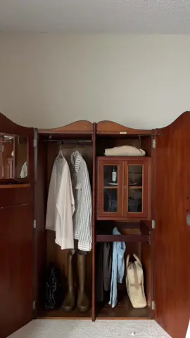 good morning from my bedroom that is almost complete.  this armoire is the perfect piece. styling it is so fun and I have a cabinet just for my colognes, which I love. want more bedroom content? #vintage #homedecor #interiordesign #armoire #bedroom #losangeles #fyp 