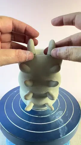 Thinking about bringing this little guy back 🐉🌀 I threw this dragon caterpillar brush holder on the wheel and finished it with a soft speckled glaze. It’s one of those weird-but-whimsical pieces that made me smile the whole time I was making it. Should I remake a few? #ceramicart #potteryvideo #wheelthrown #handmadeceramics #potteryprocess #ceramicsculpture #potterytok #brushholder #ceramicstudio #makersgonnamake #dragonart #claylife #ceramicartist #sculpturalceramics #pottersoftiktok