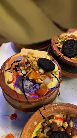Experience the uniqueness of Matka Ice Cream, a treat you can both eat and drink! This signature dessert features an array of toppings like honey, Oreo, Biskit, chocolate candies, kulfi, and dry fruits, making it a must-try. Shahid Anwar's visit to this ice cream haven is just the beginning of its popularity. *#MatkaIceCreamLove*#UniqueDesserts*#IceCreamToppingsGalore - *#ShahidAnwarApproved - *#DryFruitDelights - *#KulfiAndMore