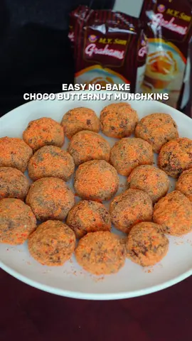 No-Bake Choco Butternut Munchkins with M.Y. San Grahams! It's as easy as 1-2-treats! Just mix, scoop, and coat, meron ka nang yummy baon or snack na pwede niyong gawin with your family this weekend! Graham Balls: 200 grams Crushed MY San Honey Grahams ¼ cup melted butter 1 cup condensed milk ½ cup oatmeal 1-2 tbsp cocoa powder Streusel: 2 tbsp melted butter 1-2 tbsp food coloring 1 cup flour ½ cup powdered sugar 1 tsp nutmeg Spinkle salt Chocolate Icing 1/4 cup warm milk 1/4 cup powdered sugar 1 tbsp cocoa powder #chocobutternut #Grahamballs #nobake #EasyRecipe #recipeidea #filipinofood #foodieph #thechinitafoodie #creatorsearchinsights 