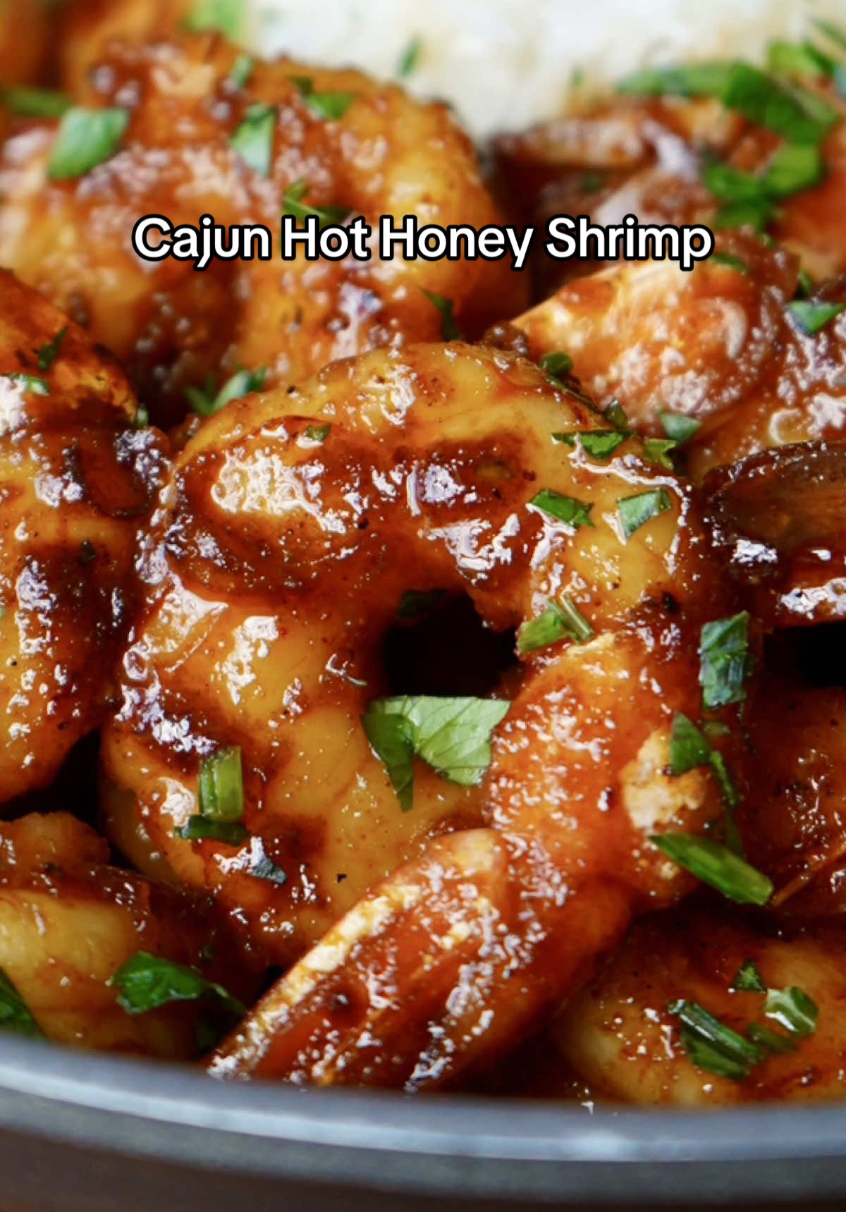 Cajun Hot Honey Shrimp 🦐🍯🔥 If you're looking for a quick, simple high-protein meal, you gotta try this one out. Sweet with a little bit of heat and so easy to make! Usually I'd add a veggie but didn't have any on hand when filming this. FULL RECIPE ⬇️ INGREDIENTS - ~1 lb XL peeled & deveined shrimp. (I used wild caught red argentine shrimp)  - 2 tbsp of avocado oil  - Cajun seasoning - ~2 tbsp butter   - ~1/4 cup hot sauce  - ~1/4 cup honey  - Fresh chopped parsley (garnish) Note(s): Measurements are estimated, adjust ingredients to your liking. DIRECTIONS  1. Add shrimp to large bowl with avocado oil and season generously with the cajun seasoning. Mix till welll combined. 2. Cook shrimp in large greased skillet over medium high heat for 2-3 min per side. Be careful to not over cook. Then remove them from the skillet.  3. Lower the heat & deglaze the pan with a bit of water then let the pan come down in heat for a couple minutes then add in the butter. Once melted, add in the cajun seasoning, hot sauce and honey. Mix till well combined.  4. Add the shrimp back to the skillet and mix till all are well coated. 5. Serve with whatever you want, drizzle some extra honey on top if you'd like, garnish & ENJOY! 🙌🏻 • • • • #explore #cooking #bhfyp #food #EasyRecipe #simple #shrimp           