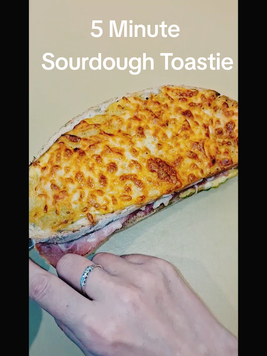 Save this for your next lazy lunch and follow for more.  Tesco finds. @Tesco  Minimal effort. Maximum crunch. cant beat a cheesy toastie. Recipe below. 5-Minute Airfryer Ham & Cheese Sourdough Toastie Ingredients: 2 slices Tesco Finest Wiltshire Cured Ham 2 slices Tesco Finest White Sourdough 2 tbsp Dijon mayonnaise 40g mature cheddar cheese, grated 40g Tesco mozzarella cheese, grated Freshly ground black pepper (optional) Method: 1. Spread 1 tablespoon of Dijon mayonnaise on one slice of sourdough. 2. Layer with the ham, then sprinkle over the cheddar cheese. Season with pepper if desired. 3. Top with the second slice of sourdough and spread the remaining tablespoon of mayonnaise on the top. 4. Sprinkle the mozzarella evenly over the top. 5. Place the sandwich in the airfryer and cook at 200°C for 5 minutes, until golden and melted. 6. Serve immediately and enjoy! #5minuterecipe #cheesy  #ninjakitchen #airfryer #onthego #tesco #quickrecipes  #mumswhotiktok  #tescofinest #toastie  #sourdough #cheesy #satisfyingvideos 