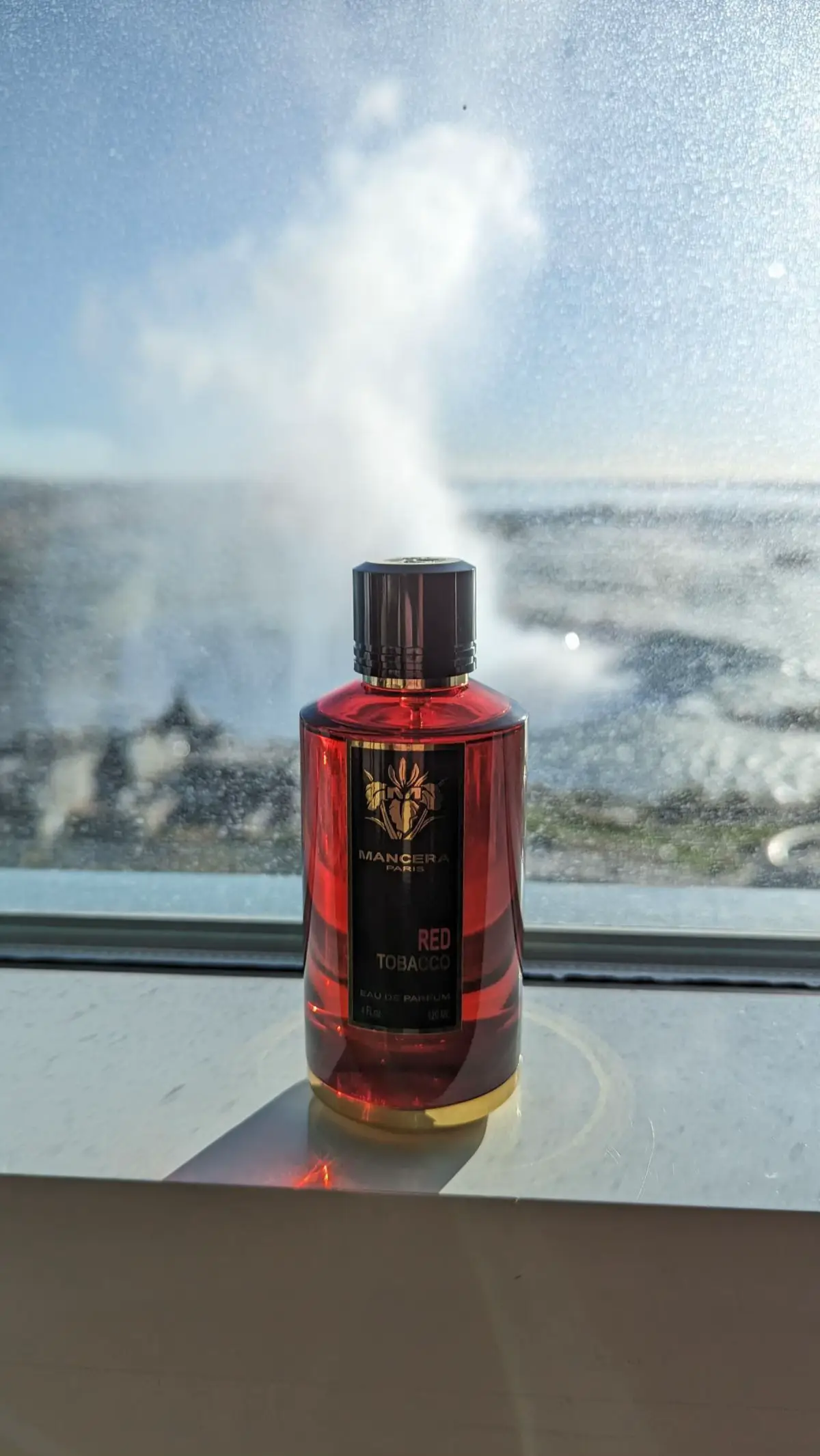 🌟Mancera Red Tobacco🌟 Mancera Red Tobacco is not a fragrance that waits politely in the background. From the very first moment it touches your skin, it demands attention—bold, intense, and utterly unapologetic. Released in 2017 and crafted by the renowned perfumer Pierre Montale, this scent feels like a roaring flame that immediately commands the room. Its opening is a complex, fiery burst that sets the tone for what’s to come. Cinnamon surges forward with a spicy warmth that is both sharp and inviting, its heat piercing through the air like a flare in the night. Layered with this is the raw, smoky depth of Nepalese oud—a wood that feels ancient, primal, and deeply textured. The oud’s animalic nuances add an almost tactile earthiness, while frankincense weaves through the composition like a resinous veil, lending a sacred, almost mystical quality to the smoke. Just as you begin to settle into this blaze of spice and resin, the fragrance throws in an unexpected twist. A bright, juicy burst of green apple and the soft, tender flesh of white peach flicker beneath the surface, adding a crisp, almost biting contrast to the warmth. These fruity notes aren’t sugary or playful; instead, they are fresh and vibrant, creating a dynamic tension that pulls the scent in two directions at once. The presence of saffron then steps in—dry, golden, and luxuriously aromatic. It’s a subtle yet powerful thread of metallic spice that ties together the opening’s fiery energy. Nutmeg follows close behind, its mellow, slightly dusty spice wrapping the composition in a comforting, almost tactile warmth, like the touch of soft leather. As this initial fire begins to cool, the heart of Red Tobacco reveals itself in all its rich complexity. Jasmine emerges, but it is far from the light, delicate floral you might expect. This jasmine is dense, sultry, and almost intoxicating, imbued with a slight indolic edge that gives it a textured warmth rather than airy sweetness. It clings to the skin with an almost hypnotic persistence. Supporting this floral intensity is patchouli, deep and earthy, grounding the composition firmly in a rich green earthiness. The interplay of jasmine and patchouli here feels steady, contemplative, like incense curling through the quiet shadows of a dimly lit chamber, inviting you into a private moment of smoky reverie. Yet the true character of Red Tobacco reveals itself in the base, where the scent’s soul takes form. Tobacco dominates this phase—not a sweet, gourmand tobacco, but one that is dry, assertive, and aged like the treasured leaves hidden away in the lining of an old velvet jacket. It is bold and unapologetic, wrapping you in its smoky embrace. Vanilla softens the edges of the tobacco’s roughness, adding a creamy, smooth sweetness that feels like a balm without diluting the power. Amber glows beneath it all, warm and resinous, with a slight stickiness that anchors the fragrance in deep golden richness. Vetiver adds a sharp, green, root-like crispness that cuts through the sweetness, lending balance and structure. Woody notes gradually emerge, particularly guaiac wood, which adds a polished, smoky softness that rounds out the base with sophistication. Finally, white musk settles in the background, lifting the dry-down into a warm, clean cloud that lingers gently on the skin long after the louder notes have faded. Mancera Red Tobacco is a scent built on contrasts and extremes. It masterfully balances heat and coolness, sweetness and smoke, density and lift. Its projection is nothing short of enormous—this is a fragrance that will fill the room within minutes and refuse to be ignored. Its longevity is legendary, easily lasting twelve hours or more on the skin and extending even longer on clothing and fabric. #ManceraRedTobacco #FragranceReview #PerfumeLovers #NichePerfume #FragranceCommunity #ScentOfTheDay #PerfumeAddict #FragranceCollection #LuxuryFragrance #MenFragrance #WinterFragrance #SpicyPerfume #OudLovers #TobaccoScent 