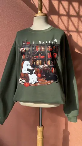 Ghost love a good book too…spooky & cozy 👻 #ghostreadingbook #BookTok #spookyread #bookishmerch #halloweencostume #halloweensweatshirt #spookyseason #ghostshirt #cozy #fyp #tiktokshop #viral 