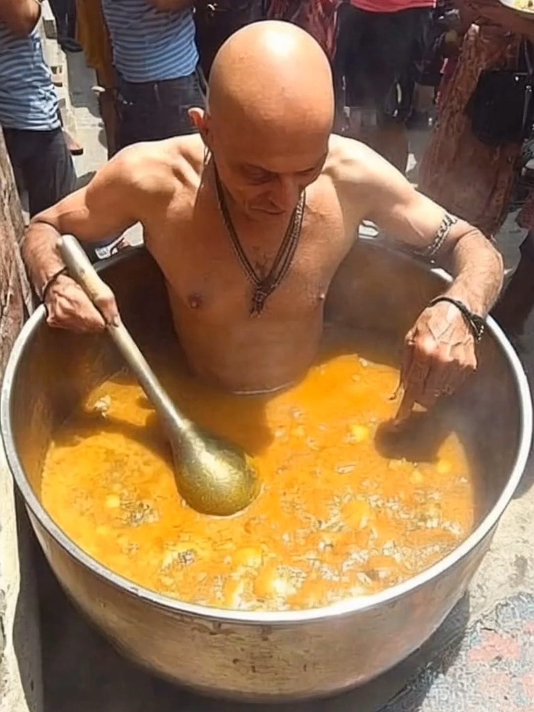 Only in this city can you find the legendary soup master who literally “puts himself” into every recipe! 🥣 This chef is famous for serving up soup straight from the pot he’s sitting in, and locals swear it’s the secret ingredient that makes it the best in town. The line never ends, and everyone’s convinced a little human touch (or maybe more) gives the broth its magic. Would you dare try a bowl of his one-of-a-kind soup?The Indian street food final boss won't disappoint you. #StreetFood #Soup  @hailuoai_official 