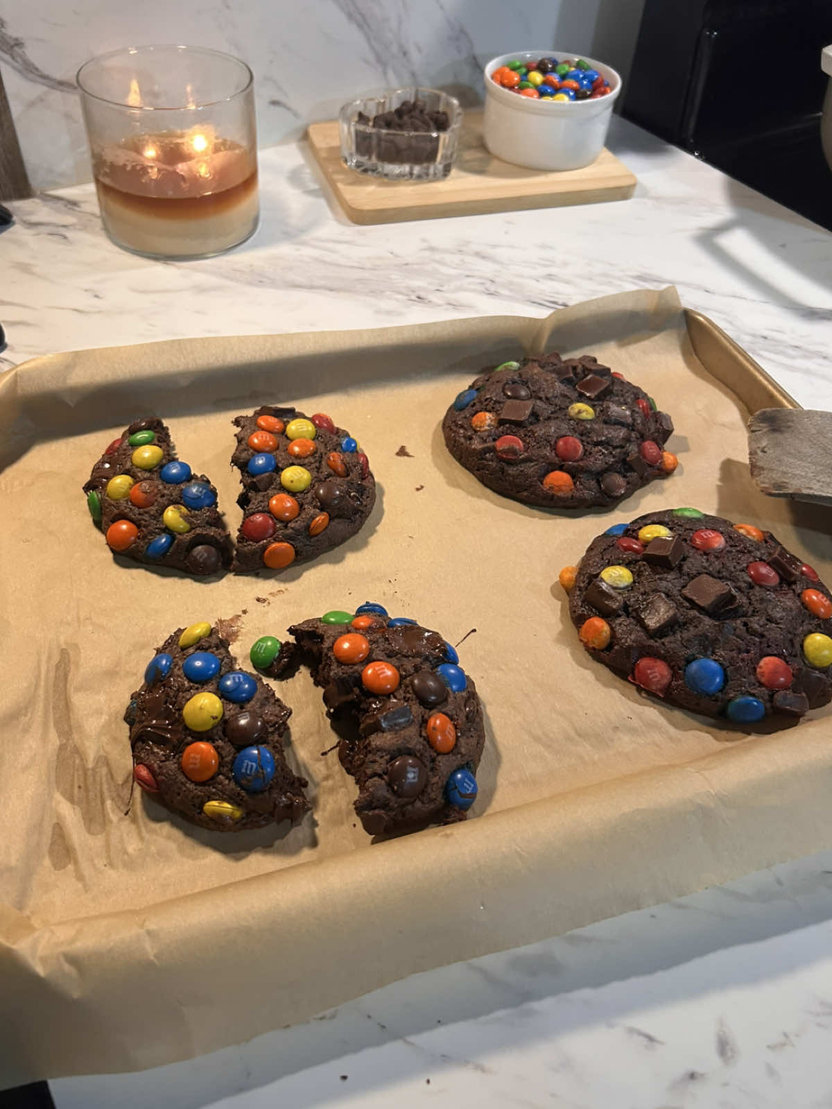 the best double chocolate m&m cookies !! no chill time ;) 1/2 cup cold butter(113g) 6 tbsp brown sugar(75g) 6 tbsp granulated suga(75g) 1 egg  1 egg yolk 1 tsp vanilla extract(5g) 1 cup all-purpose flour(120g) 1/3 cup cocoa powder(35g) 1/2 tsp baking soda(3g) 1/2 tsp salt(3g) 3 tbsp cornstarch(24g) m&ms  & i used dark chocolate  in a bowl add your cubed cold butter, whisk in the brown sugar, granulated sugar, egg, egg yolk, and vanilla until smooth. fold in the flour, cocoa powder, baking soda, salt, and cornstarch and mix until just combined. fold in any chocolate. scoop & roll into m&ms and chocolate chips ( the dough will be sticky so use a scoop or wet your hands slightly when handling) then place onto a baking sheet and bake at 375•F until the edges are set and the centers look slightly soft, about 12-15 minutes. let them cool on the tray before moving. ( if your cookies are smaller they’ll take less time to cook! )   #doublechocolate #cookies #chocolate #EasyRecipe #baking 
