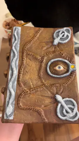 Recreated the Hocus Pocus Spellbook and he’s 😩 beautiful.  I’ve seen some other creators make this including @sally  the crafty queen💙  I’ve seen many different methods, but I chose to sculpt it out of clay and then paint it. It turned out even better than I expected 🥲 #hocuspocus #spellbook #halloween #DIY 