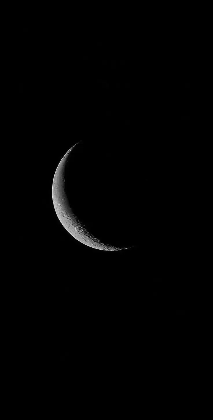 A hauntingly beautiful moon casting its cold glow through the dark, endless sky — mystery meets serenity. #moon #follow #foryou #viral #wallpaper 