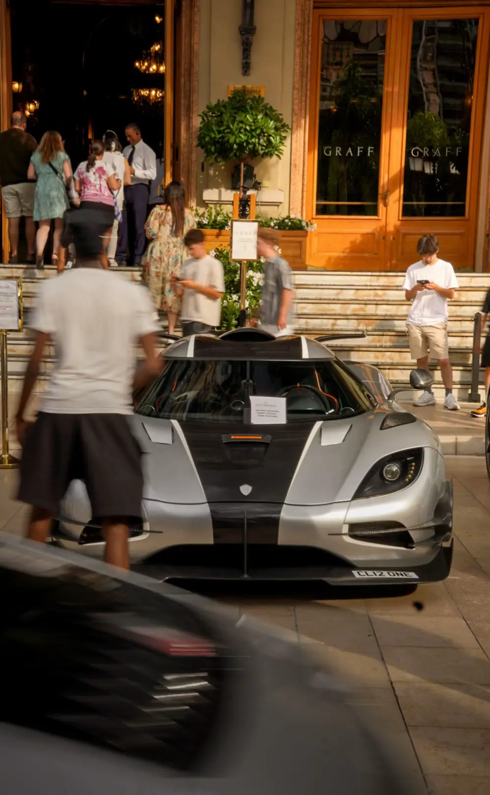 The Koenigsegg One:1, produced between 2014 and 2015 by Swedish manufacturer Koenigsegg, is far more than just a hypercar. It’s a technological demonstration, an engineering masterpiece, and a car that made history with its extreme performance. Its name comes from its incredible power-to-weight ratio: 1,360 horsepower for 1,360 kilograms — that is, one horsepower per kilo — earning it the nickname “megacar,” in reference to its output of one megawatt. It was the first production car in the world to achieve this perfect ratio, which had previously only existed as a theoretical benchmark. Under the hood is a 5.0-liter twin-turbocharged V8 engine, entirely designed and built in-house by Koenigsegg. It produces 1,360 horsepower and 1,371 Nm of torque, sent to the rear wheels through a dual-clutch transmission. Running on E85 fuel, the engine delivers not only brutal power but also benefits from better combustion and cooling. The performance figures are breathtaking: 0 to 100 km/h (62 mph) in 2.8 seconds, 0 to 200 km/h in 6.6 seconds, and 0 to 300 km/h in 11.9 seconds. It reaches 400 km/h in around 20 seconds, and its top speed is estimated to exceed 440 km/h, though it has never been officially measured at maximum speed. But the One:1 is not just an engine in a lightweight shell. It sits on a carbon fiber monocoque chassis, and the entire body is also made from ultra-light carbon composite. Thanks to this extreme construction, it weighs exactly 1,360 kg dry. Its aerodynamics are active, featuring a movable rear wing, an adjustable front splitter, and electronically controlled side flaps. At 260 km/h, the car generates up to 610 kg of downforce, providing remarkable stability even at insane speeds. It also features Koenigsegg’s unique Triplex suspension system, along with massive carbon-ceramic brakes capable of handling extreme deceleration. Only 7 examples of the Koenigsegg One:1 were ever built, including one prototype. Each car was custom-built to the buyer’s specifications, and all are now in the hands of private collectors. Their value exceeds several million euros and continues to rise. Yet the One:1 is not just a collector’s item — it has proven itself on the track, notably setting an impressive lap time at Japan’s Suzuka Circuit, outperforming track-focused cars like the Nissan GT-R Nismo. When it was released, the One:1 had no true rivals. It outclassed the Bugatti Veyron in terms of raw numbers, shattered established limits, and redefined what a street-legal car could achieve. It wasn’t until years later, with models like the Bugatti Chiron Super Sport or the Rimac Nevera, that other cars began approaching its level of performance. What makes Koenigsegg truly stand out is its philosophy: a small independent company based in Sweden, designing nearly everything in-house — engine, transmission, chassis, aerodynamics, electronics. This obsessive, hands-on approach to engineering is what makes the One:1 so unique. In short, the Koenigsegg One:1 is more than just a collection of wild performance stats. It represents a radical vision of what automotive performance can be — no compromises, no limits, just pure innovation. Even today, it remains a living legend and a historical milestone in the evolution of the hypercar.  #koenigseggone1 #automotivephotography #sonya6400 #monacocars #supervettura @supervettura 