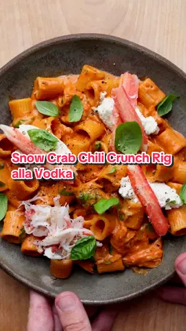 Summery Pasta Goodness = Snow Crab Chili Crunch Rigatoni alla Vodka. Yes Please! A New Brunswick-Flavoured Seaside Twist On A Classic Comfort Dish. Full Recipe Below!   New Brunswick Snow Crab Is Incredible! Sweet, Delicious, And A Fantastic Source Of Protein!  1 pound of your favorite rigatoni  1/4 cup butter, divided  2 tablespoons olive oil  2 large shallots, minced  4 garlic cloves, minced  3 tablespoons tomato paste  2 tablespoons chili crunch   2 ounces vodka  ¾ cup heavy (35%) cream  ½ cup grated Parmigiano Reggiano, plus more for topping  1/2 pound New Brunswick Snow Crab  1 cup ricotta  ½ cup minced fresh basil leaves  Juice of ½ a lemon  Sea salt and cracked black pepper  Cook the pasta in salted water according to the package directions (al dente, please). Drain and reserve ½ cup pasta cooking liquid.  Meanwhile, heat a large skillet over medium-heat and go in with 1/2 the butter and the olive oil. When melted, add the shallot, cook until softened, about 3 - 4 minutes. Add the garlic, tomato paste, and chili crunch, then cook for 2 minutes, stirring often.  Next add the vodka, cream, season with a good pinch of salt, and reserved pasta cooking liquid, bring to a simmer and cook until slightly reduced and thickened, about 5 to 6 minutes. Add the remaining butter, parm, and several cracks of black pepper, add 1/2 of your New Brunswick Snow Crab, then mix well until the butter is melted. Go in with the pasta and toss to mix well, then divide among individual serving plates.  Top with your ricotta, more Snow Crab, fresh basil, a squeeze of  lemon, more parm & cracked black pepper. Delicious! #food #Recipe #crab #EasyRecipe #quickrecipe