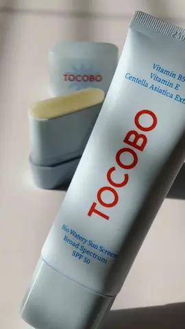*gifted* Let me introduce you to my must have summer essentials for keeping my skin looking so good: TOCOBO SPF Dewy Reapply Duo! This duo consists of Tocobo Bio Watery Sun Screen Broad Spectrum SPF50 + Cotton Airy Sun Stick Mini Broad Spectrum SPF50. This duo has the following benefits: *Clinically proven to offer broad-spectrum UV protection *Controls excess oil while maintaining skin hydration *Lightweight, non-greasy formula with a matte finish *Convenient, mess-free reapplication in a portable mini stick form. The Key Ingredients (only vegan ingredients, low-irritation): -Vitamin E Known for its powerful antioxidant properties, Vitamin E supports skin nourishment and helps reduce the effects of environmental damage. -Vitamin B5 A plant-derived ingredient that helps moisturize and hydrate the skin, enhancing skin's natural barrier. -Centella Asiatica Extract Protects sensitive skin & provides quick soothing care. This Bio Watery Sun Screen goes on so smoothly and blends in perfectly leaving no white cast, even when applying a large amount of sunscreen. It makes my oily and uneven skin look smooth, blurred, and shine-free. The Mini Cotton Airy Sun Stick is so convenient to carry and use anytime. It fits nicely into a pocket, pouch, or bag. Perfect for any touch ups during girly moments when on the go (getting ready at home, going on errands, golden hour moments outside).  Small in size, big on protection. Compact and easy to carry, without compromising on UV defense. It goes on clear with no white cast – perfect for all skin tones. It helps control oil and prep the skin for smooth, long-lasting makeup. It can also be used as a fixing cushion after applying makeup to keep your makeup looking fresh and shine-free all day. Available at TikTok Shop. Thank you @TOCOBO @TOCOBO US and @nurilounge.us  #tocobo #spf #sunscreenviral #tocobosunstick #sunscreen #sunscreenreview #skincare #suncare #skincaretips #skincareroutine #kbeauty #glowingskin #sunscreeneveryday #oilyskin #nosebumsunstick #sebumcontrol #airysunstick #mattifying #oneswipeupmatte #nosebum
