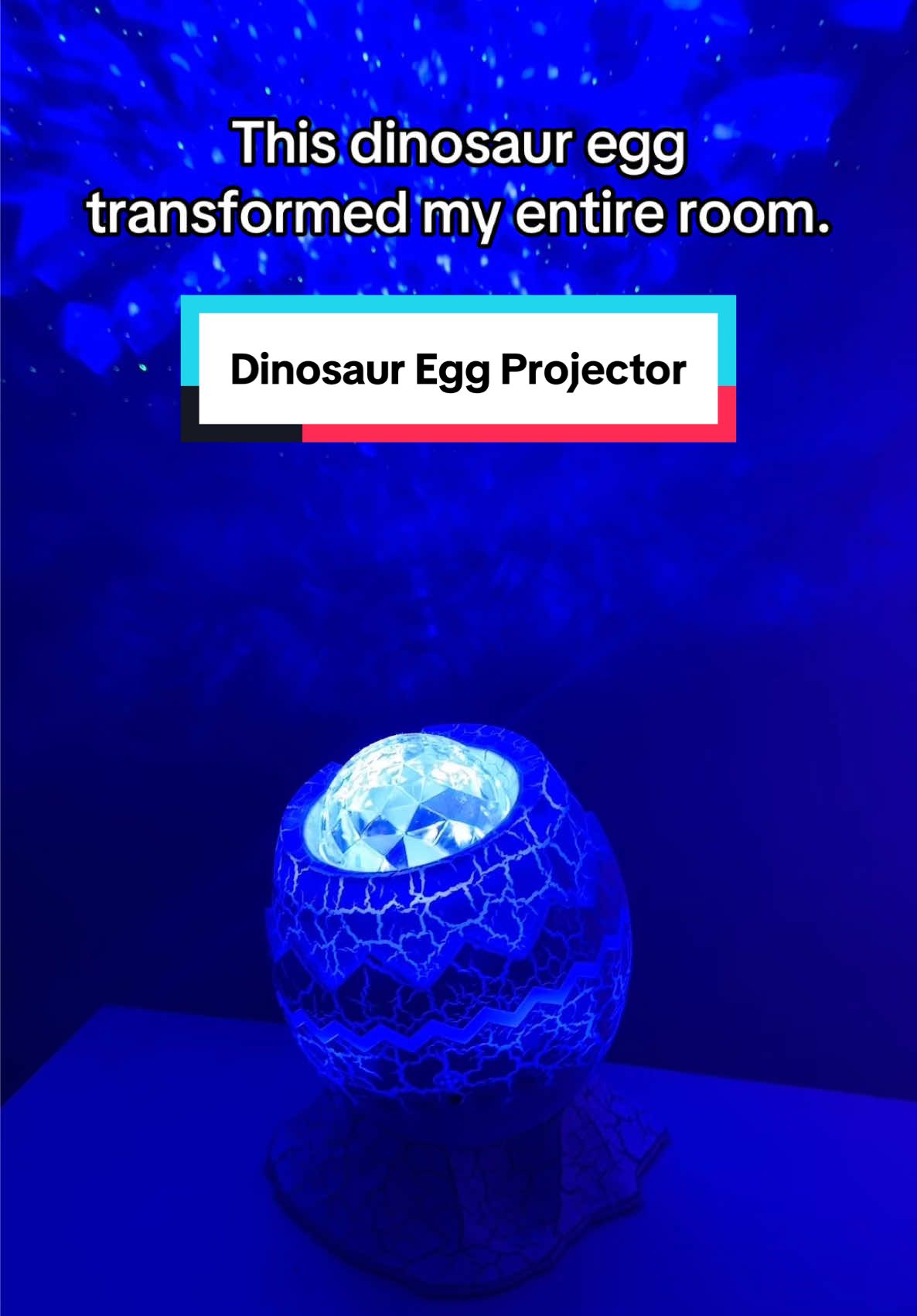 This dinosaur egg projector changes the ambience of any room. It projects the galaxy right onto your walls and it looks so pretty in a dark room! You can use this decorate a kids room - especially a space themed room, a playroom, your own space… looks cool anywhere.  #playroominspo #kidsroominspo #spaceroom #spacetheme #galaxyprojector #starprojector #dinosauregg #dinosaureggprojector #tiktokshopcreatorpicks 