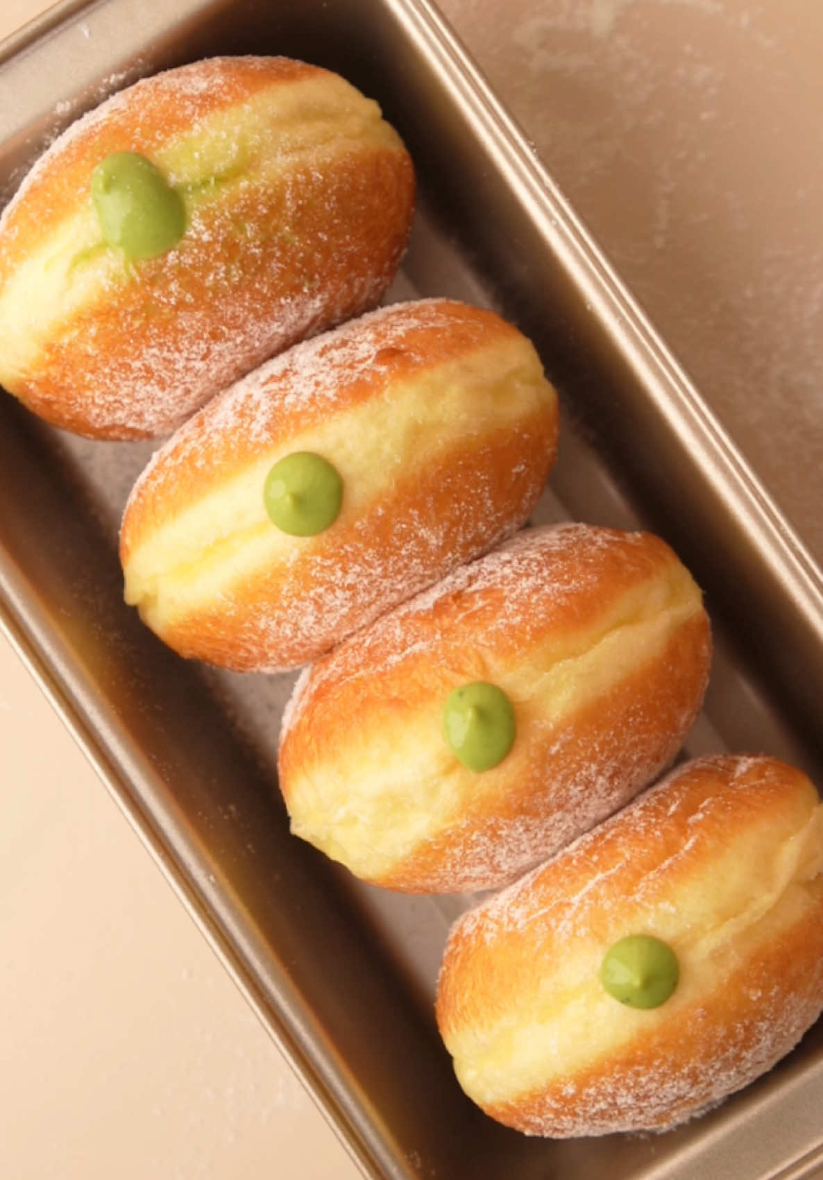 donat matcha custard recipe (italian doughnut—bomboloni) resep donat: (10 pcs—45g/each) 80 ml susu cair 2 btr telur utuh 10g es batu 260g tepung pro. tinggi 4g ragi instan 30g gula pasir ½ sdt garam 35g mentega (suhu ruang) resep matcha custard: 2 btr kuning telur 200 ml susu cair 40g gula pasir 15g tepung maizena 5g bubuk matcha 20g mentega tawar ½ ekstrak vanilla 80 ml whipping cream tutorial lengkap di video!✨ tips tambahan: • jika pakai ragi instan, bisa langsung dicampurkan ke adonan tanpa aktivasi. • es batu berfungsi untuk mengontrol suhu adonan biar gak ‘panas’. kalo panas bisa bikin adonan gampang overproof dan bau ragi jadi menyengat • pakai tepung protein tinggi (cakra, dll.) biar pembentukan glutennya bagus. jadi bisa kalis dan elastis • kalau adonan terlalu encer, bisa tambahkan 1 sdm tepung pro. tinggi perlahan sampai tidak terlalu encer. begitu sebaliknya, jika terlalu kering bisa tambahkan 1 sdm susu/air #donat #bomboloni #matcha #creatorsearchinsights 