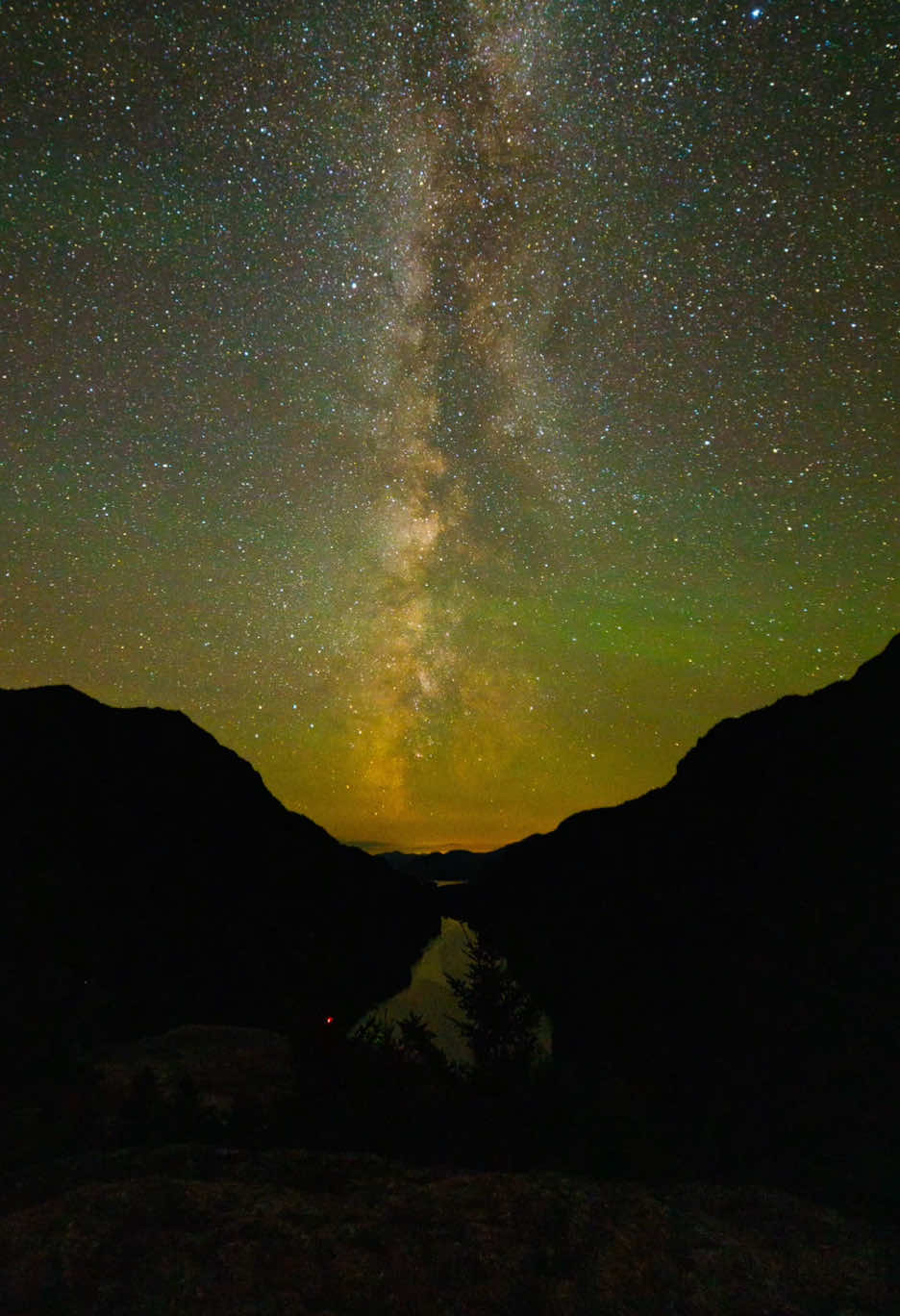 Iridescent Ripples in the Adirondacks ⛰️🌌 This is a timelapse of the Milky Way at one of the most iconic places in the Adirondacks. If you notice the waves of green light in the air, you’re not the only one :) This is airglow, a phenomenon where air particles are supercharged to a higher energy state by the sun during the day and return to a lower energy state at night, releasing energy in the form of light. Often these lights are too faint to be seen with the naked eye, however, a camera with long exposure can easily capture it.  Shot on my @canonusa EOS R + @Rokinon Lenses 14mm f/2.8 Series II 20s | f/2.8 | ISO 6400 Remember to practice Leave No Trace when visiting the Adirondacks :) #canon #milkyway #airglow #adirondacks #astrologytiktok 
