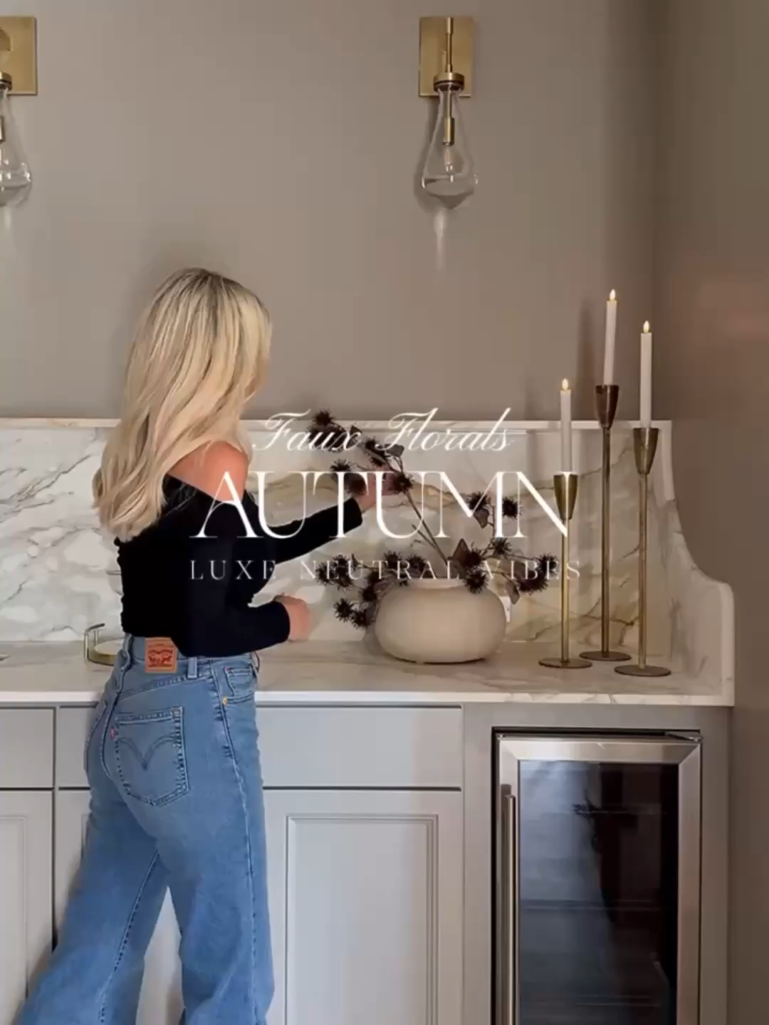 🍁LUXURY FAUX FALL FLORALS🍁 — MODERN NEUTRAL STYLING IN A SCULPTURAL VASE. I styled this space with luxe faux florals to bring in neutral fall tones and cozy texture. Each stem—from spiked thistles to golden eucalyptus—adds depth without overwhelming the space. Paired with my sculptural white vase and brass taper holders, this setup feels high-end but effortlessly organic. HOW TO SHOP: Link in BIO to SHOP my Home #Amazon #TheHillaryStyle #modernorganicdecor #neutralfallflorals #luxuryhomedecor #minimalisthomedecor #interiorinspo #fauxflorals #fallhomestyling #restorationhardwaredupe #cozyneutralhome #sculpturalvase #candlestickdecor