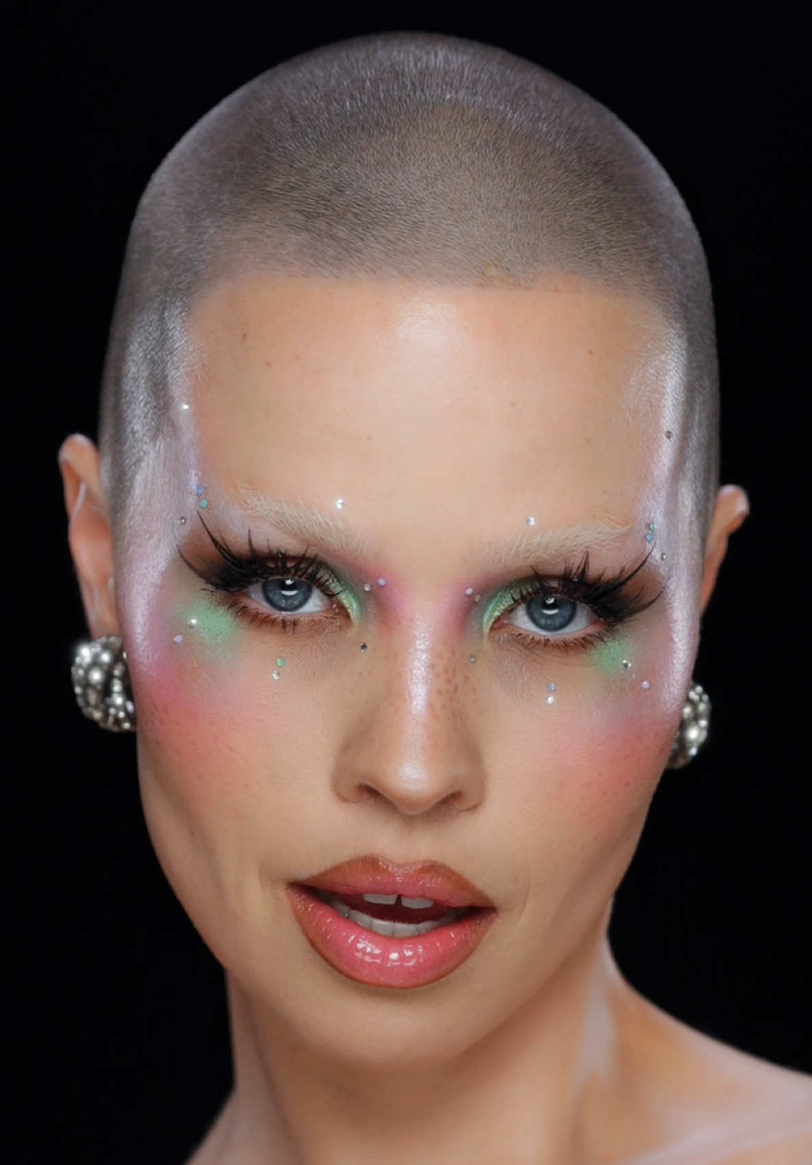 PRODUCTS USED: @NARS Cosmetics light reflecting foundation and concealer  @makeupbymario softsculpt bronzing and shaping serum in Fair @The Kitpak palette filled with @maccosmetics paints and @KryolanOfficial Supra color and @madebymitchell paints 🩵 The following palette contains color eyeshadows mainly from @Blend Bunny Cosmetics  #makeupbymario surreal skin soft blur setting powder  #blendbunnycosmetics x @Ellis_Atlantis ELLIS vol 2 palette (most wonderful set of neutral mattes I’ve ever seen) using mainly Dust, Wilt, Evoke, Withered, Remanence.  and then followed by the Garden of Stars palette (all shimmers) using Luco, Illusive, Haunting, Estranged and a little bit of Lustre!  @Glisten Cosmetics LTD Coffee Cup Wet Liner  I then applied @Dolce & Gabbana Everfull XL mascara, applied lash clusters, cut up some very very very long lashes and then topped with glisten’s Spectra Lash in dark Brown Then applied some stones from @GetStonned and added a few random silver ones to go with the dress which is by #cultnaked 😍!  Lips were done as follows: @DiegodallaPalma lip liner, then added a bit of pink paint to the lips and topped it with a delicious @TIRTIR Inc. waterism lip plumper!  DRESS: @CULTNAKED STARDUST dress in Silver  EARRINGS: @SilviaGnecchiMilano  silviagnecchimilano called Mini Shells